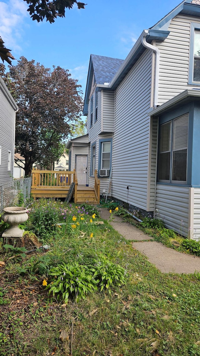 view of home's exterior featuring a deck