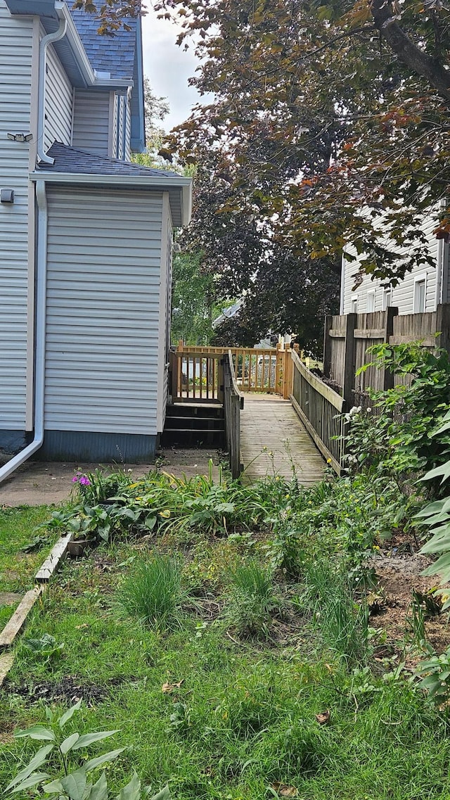 view of yard featuring a wooden deck