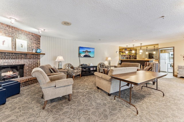 9700 Portland Ave S Unit 225, Bloomington, MN 55420 - carpeted living area with a textured ceiling and a brick fireplace