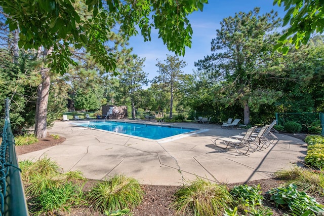 9700 Portland Ave S Unit 225, Bloomington, MN 55420 - community pool with a patio and view of wooded area