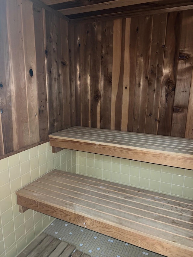 view of sauna with wood walls