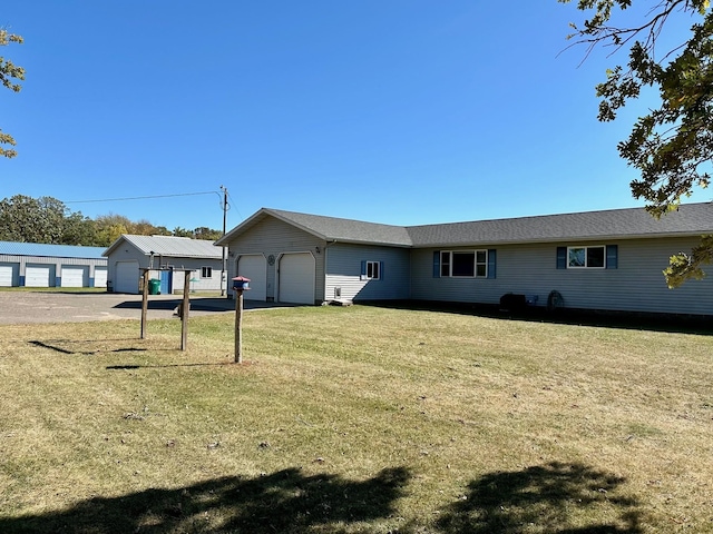 exterior space featuring a garage and a yard