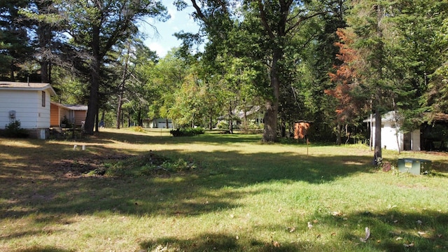 24126 County Road 19, Merrifield, MN 56465 - view of yard featuring an outbuilding and a garage