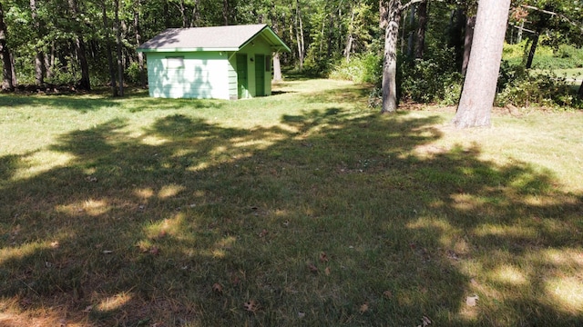 24126 County Road 19, Merrifield, MN 56465 - view of yard with an outbuilding, a wooded view, and a shed