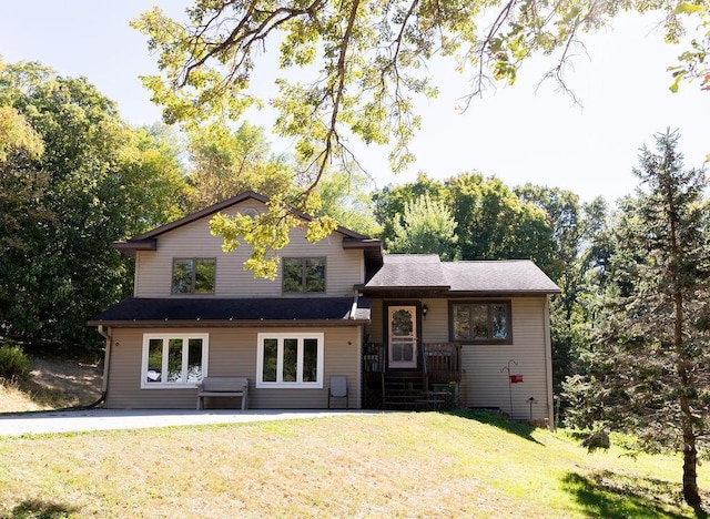 50165 Sailer Rd, Frazee, MN 56544 - tri-level home featuring a front lawn and a patio area