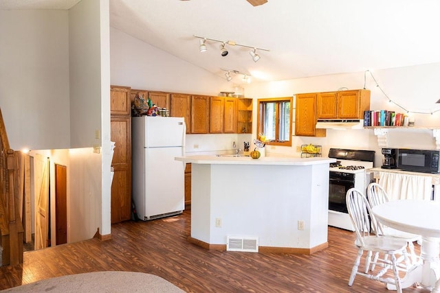 50165 Sailer Rd, Frazee, MN 56544 - kitchen featuring dark wood-type flooring, white appliances, and high vaulted ceiling