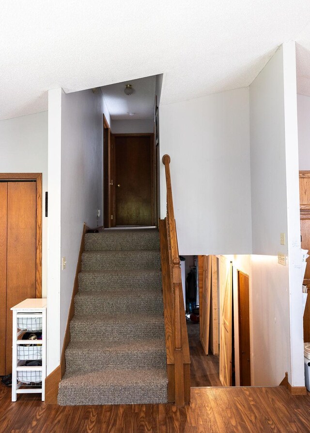 50165 Sailer Rd, Frazee, MN 56544 - stairway with lofted ceiling and hardwood / wood-style floors
