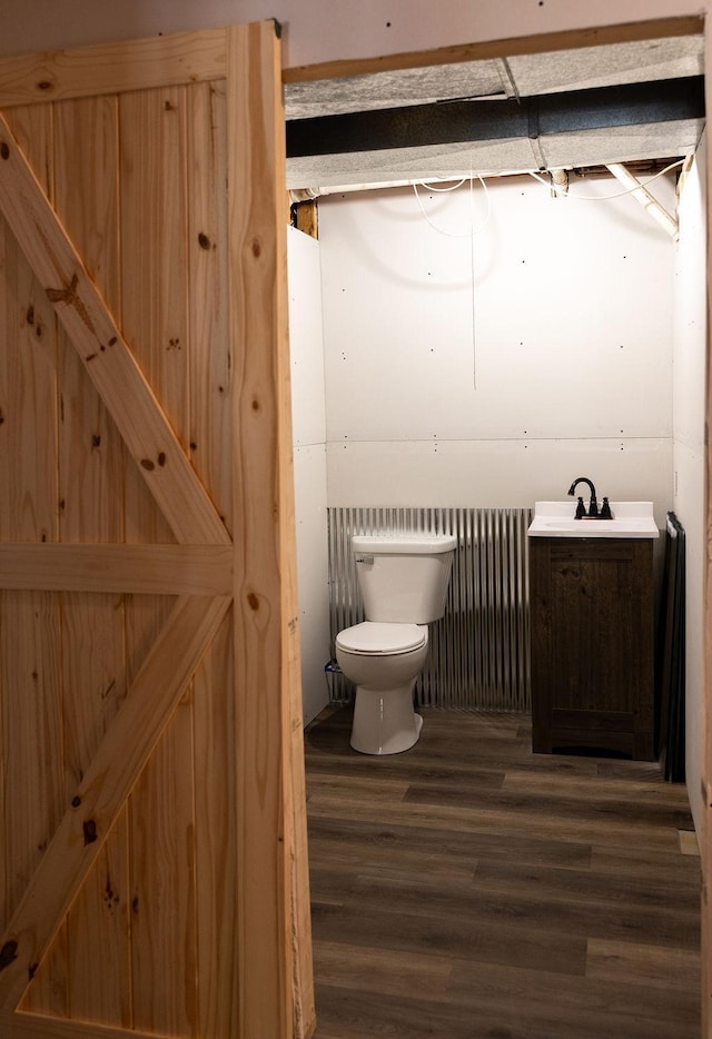 50165 Sailer Rd, Frazee, MN 56544 - bathroom with hardwood / wood-style flooring, sink, and toilet