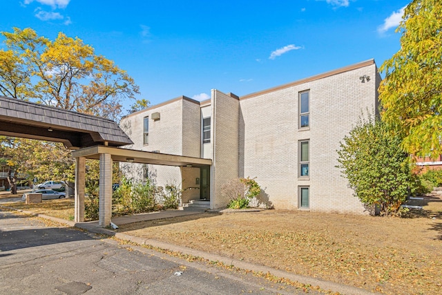6301 York Ave S Unit 102, Edina, MN 55435 - exterior space featuring brick siding and mansard roof