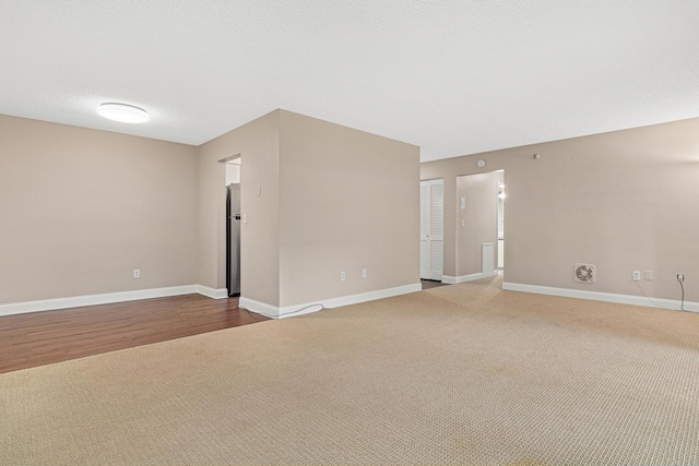 6301 York Ave S Unit 102, Edina, MN 55435 - unfurnished living room featuring carpet flooring, visible vents, and baseboards
