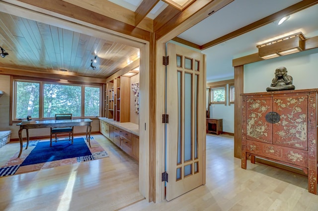 interior space with light wood-type flooring and wood ceiling