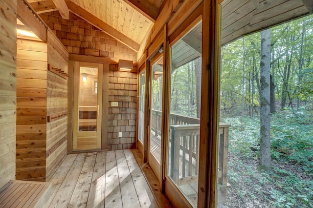 unfurnished sunroom with wooden ceiling and lofted ceiling