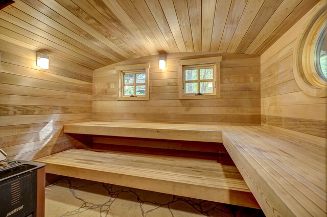 view of sauna / steam room with wood ceiling and wood walls