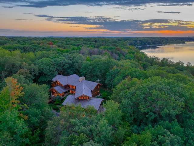 aerial view at dusk with a water view