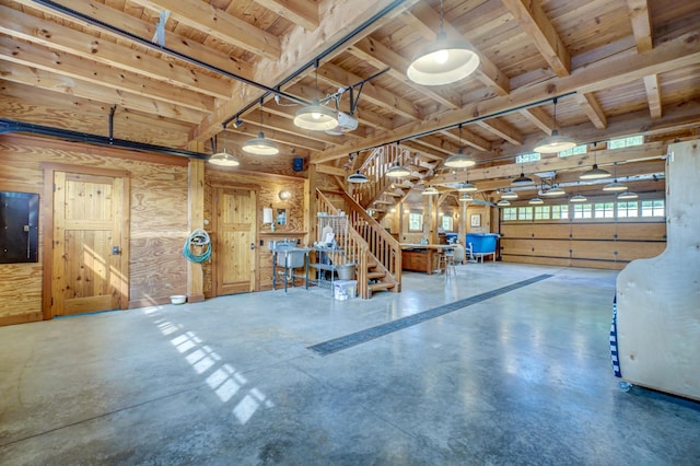 garage featuring wood walls