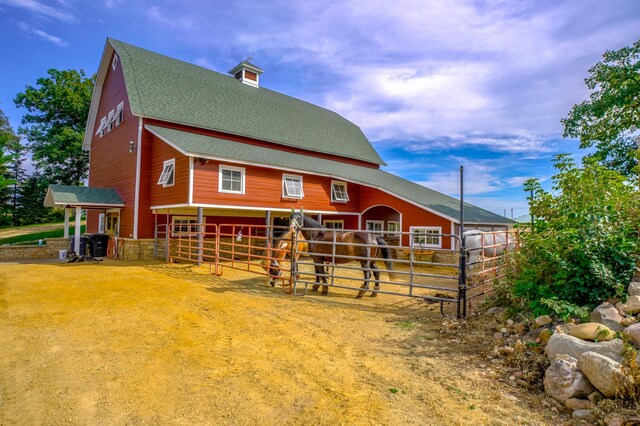 back of house with an outbuilding