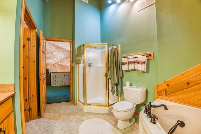 full bathroom featuring vanity, separate shower and tub, and toilet