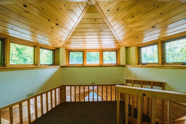 interior space featuring lofted ceiling, wooden ceiling, and a healthy amount of sunlight