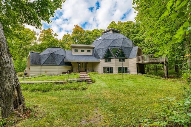 56008 County Road 4, Spring Lake, MN 56680 - back of house with a yard, a shingled roof, a gambrel roof, and a wooden deck