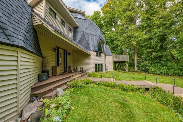 view of yard featuring a wooden deck