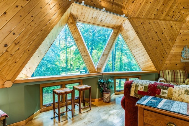 56008 County Road 4, Spring Lake, MN 56680 - bedroom featuring baseboards, lofted ceiling, multiple windows, and wood finished floors