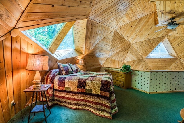 bedroom featuring wooden walls, multiple windows, and carpet flooring