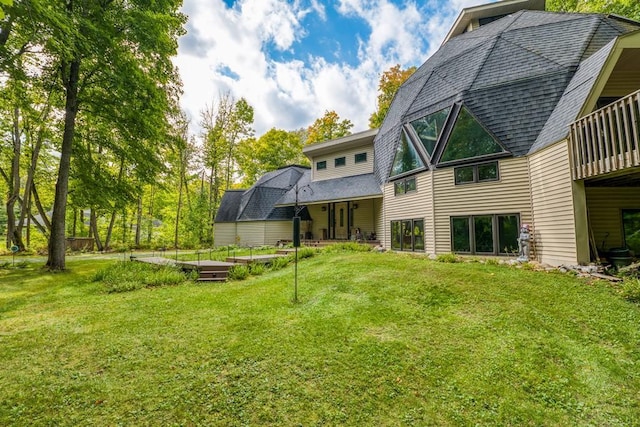56008 County Road 4, Spring Lake, MN 56680 - rear view of house with a lawn and a shingled roof