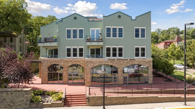 rear view of house featuring a balcony