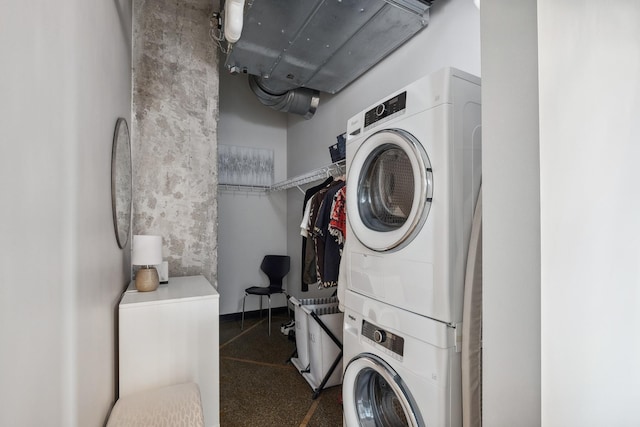 laundry area with stacked washer and dryer