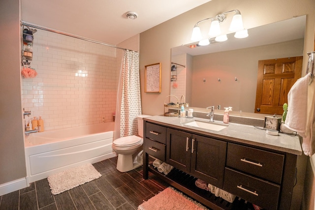 full bathroom featuring shower / bath combination with curtain, vanity, and toilet