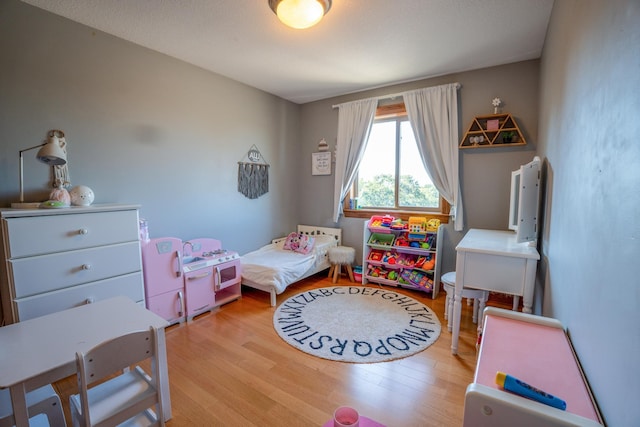 bedroom with light hardwood / wood-style flooring