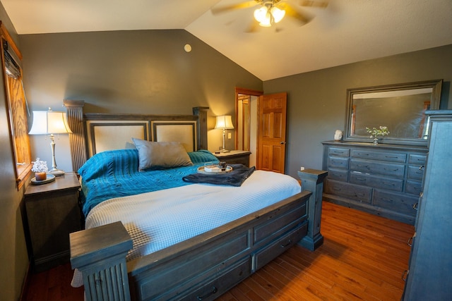 bedroom featuring ceiling fan, lofted ceiling, and dark hardwood / wood-style floors