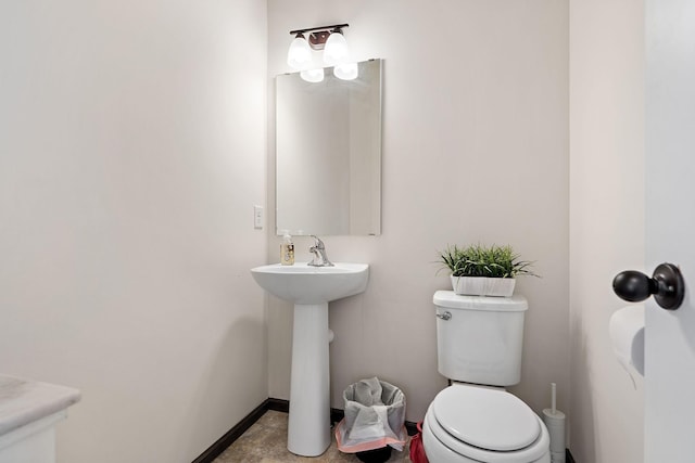 bathroom with sink and toilet