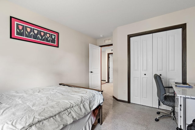 carpeted bedroom with a closet