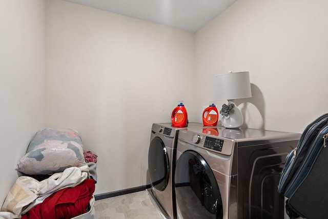 clothes washing area with washing machine and clothes dryer