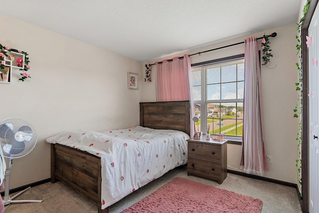 bedroom featuring light colored carpet