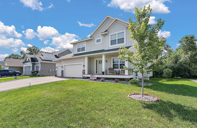 craftsman-style home with a garage, covered porch, and a front lawn