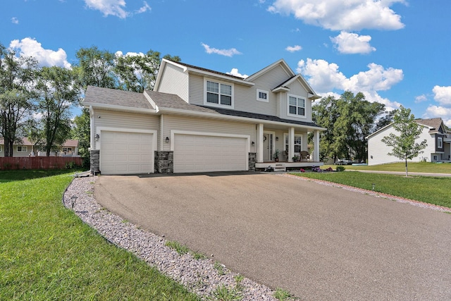 view of front facade featuring covered porch and a front lawn