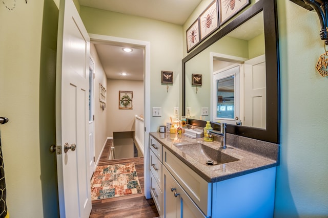 bathroom with vanity and hardwood / wood-style flooring