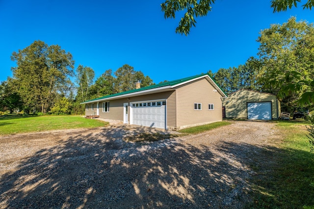 garage with a yard