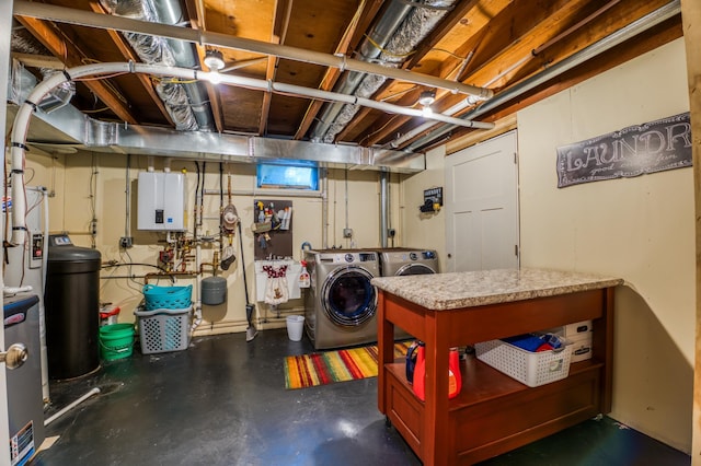 basement with water heater and washing machine and dryer