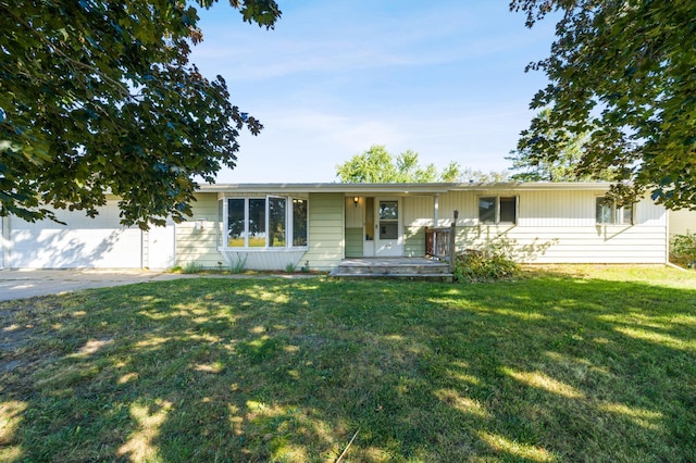 single story home featuring a front yard and a garage