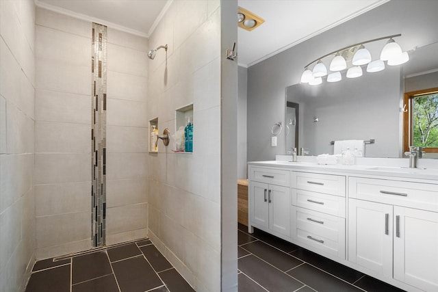 bathroom with walk in shower, crown molding, vanity, and tile patterned floors