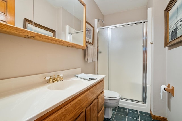 bathroom with vanity, a shower with shower door, toilet, and tile patterned flooring