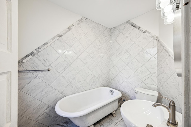 bathroom with a bathtub, toilet, and tile walls