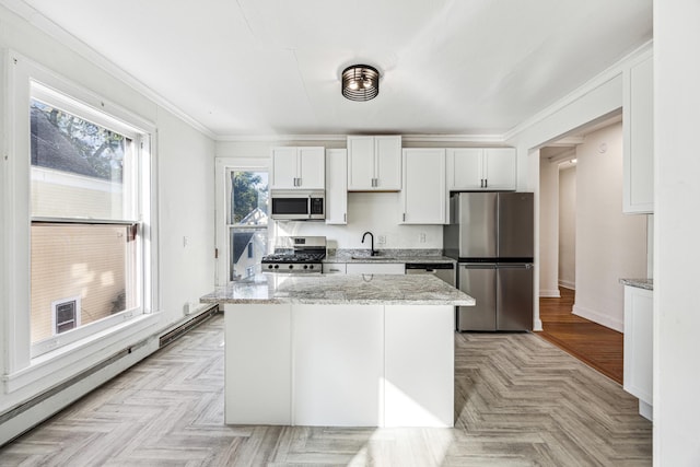 kitchen featuring light parquet flooring, light stone countertops, stainless steel appliances, and white cabinets