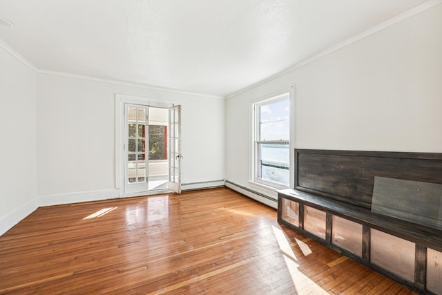 unfurnished living room featuring light hardwood / wood-style floors, ornamental molding, and a baseboard radiator