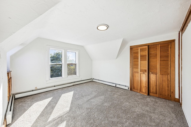 additional living space featuring lofted ceiling, a textured ceiling, and carpet floors