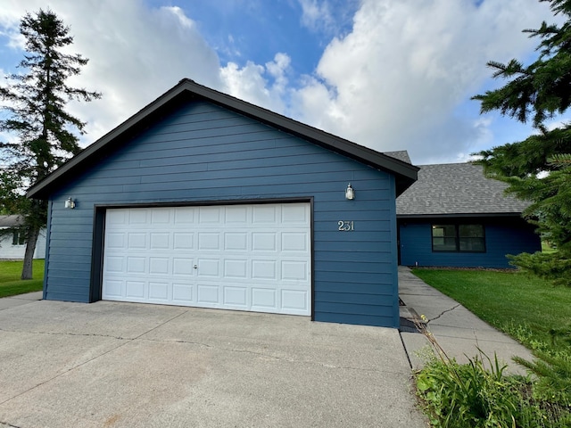 view of front of home with a garage and a front yard