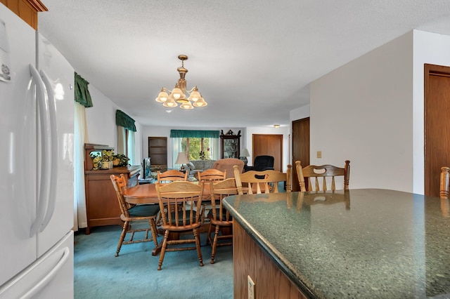 dining room featuring light carpet and a notable chandelier